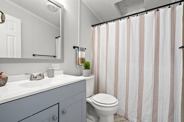 bathroom with vanity, ornamental molding, toilet, and a textured ceiling