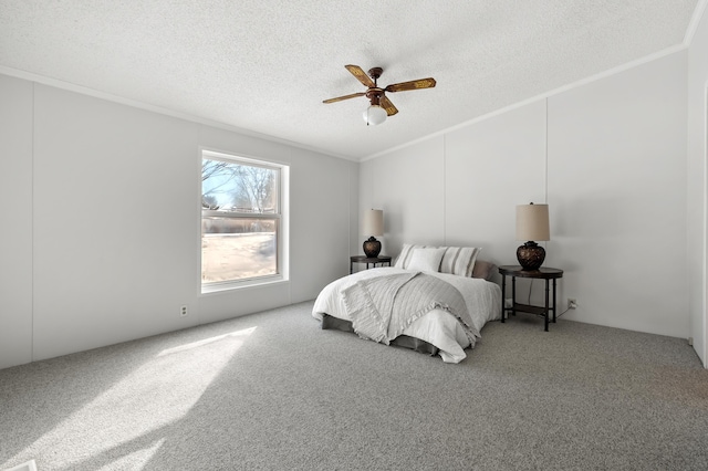 carpeted bedroom with ceiling fan, ornamental molding, and a textured ceiling