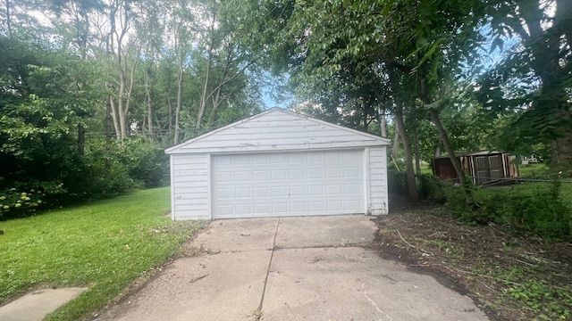 garage with a lawn