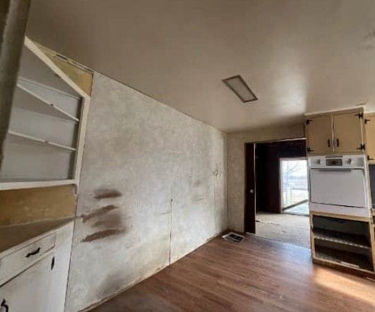 kitchen featuring white oven and light wood-type flooring