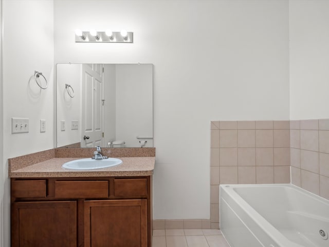 bathroom with toilet, tile patterned floors, a bath, and vanity