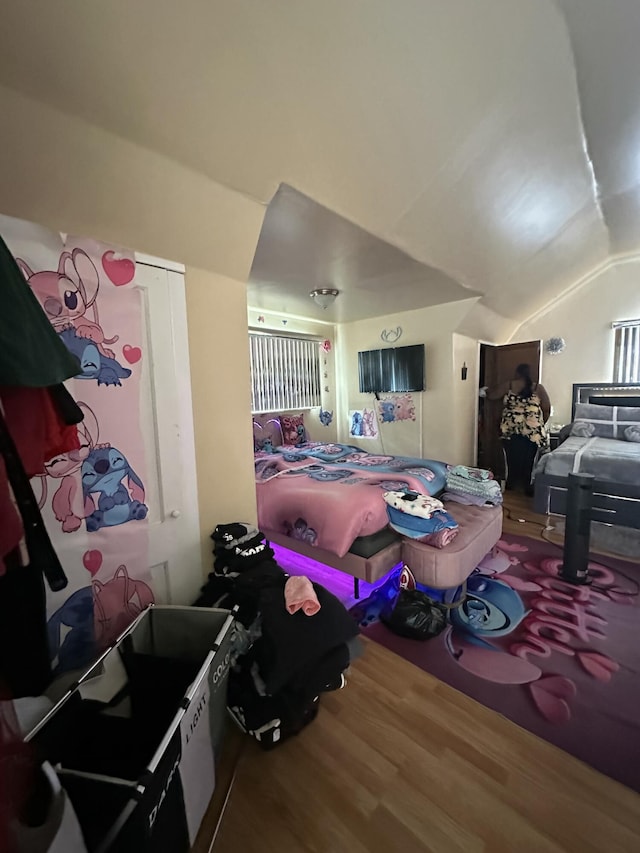 bedroom featuring vaulted ceiling and hardwood / wood-style floors