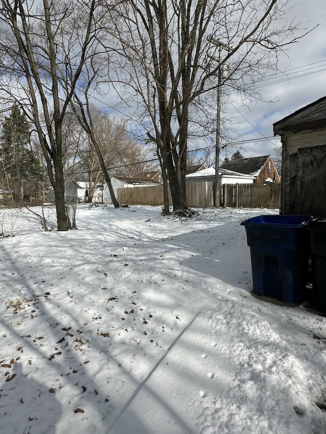 view of yard layered in snow