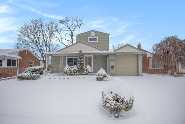 view of front of property with a garage and covered porch