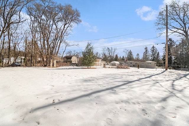 view of yard layered in snow