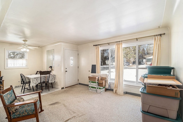 interior space with ceiling fan, a healthy amount of sunlight, and carpet floors