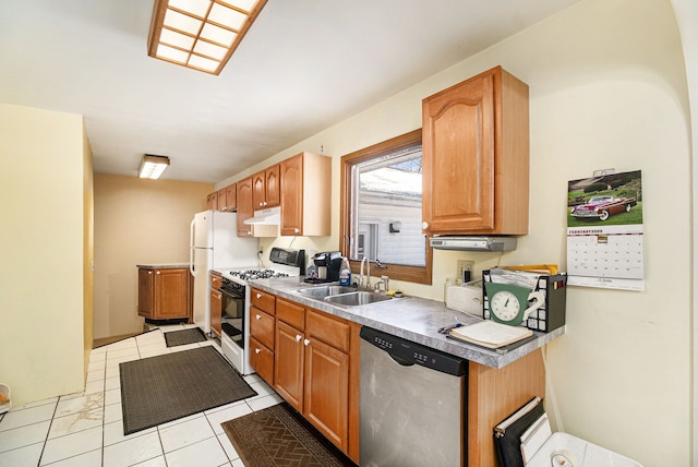 kitchen featuring sink, light tile patterned floors, gas range oven, and dishwasher