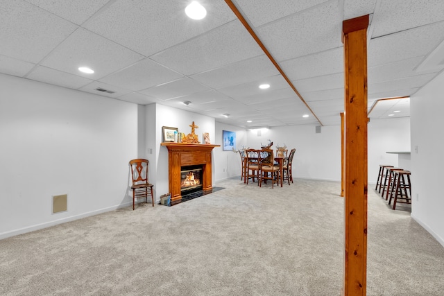 interior space with a paneled ceiling