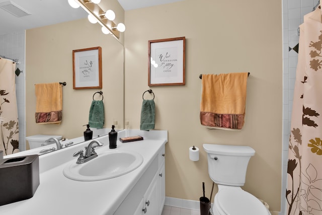 bathroom with vanity, a shower with curtain, and toilet