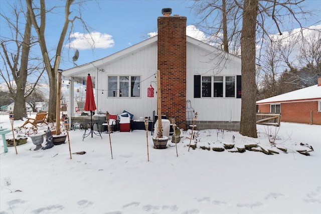 view of snow covered house