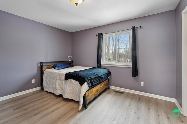 bedroom featuring light hardwood / wood-style floors