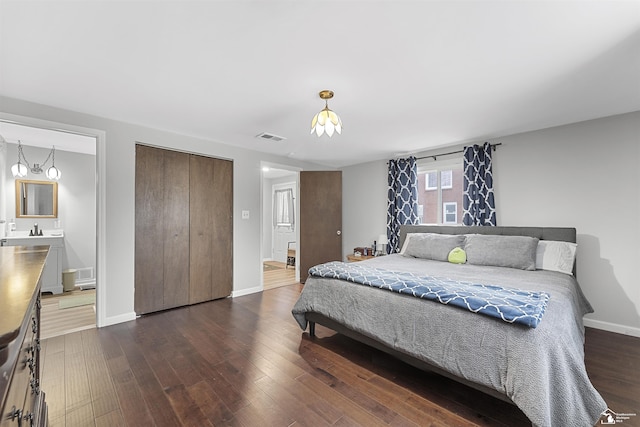 bedroom featuring dark hardwood / wood-style floors and sink