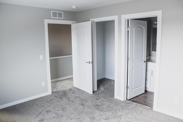 unfurnished bedroom featuring light colored carpet