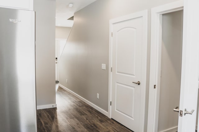 hallway featuring dark wood-type flooring