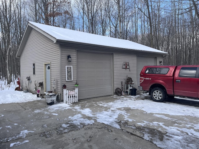 view of snow covered garage