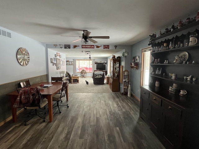 dining room with dark hardwood / wood-style floors and ceiling fan