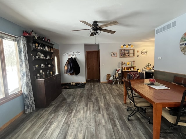 dining room featuring a wealth of natural light, dark hardwood / wood-style floors, and ceiling fan