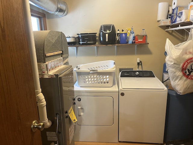 laundry room featuring separate washer and dryer