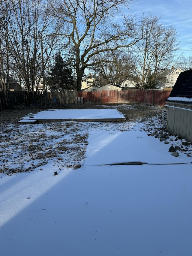 view of yard layered in snow