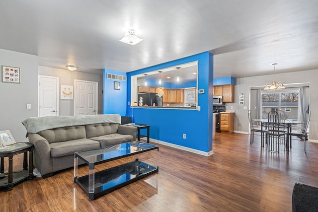 living room with dark hardwood / wood-style floors