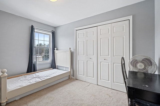 carpeted bedroom with a closet