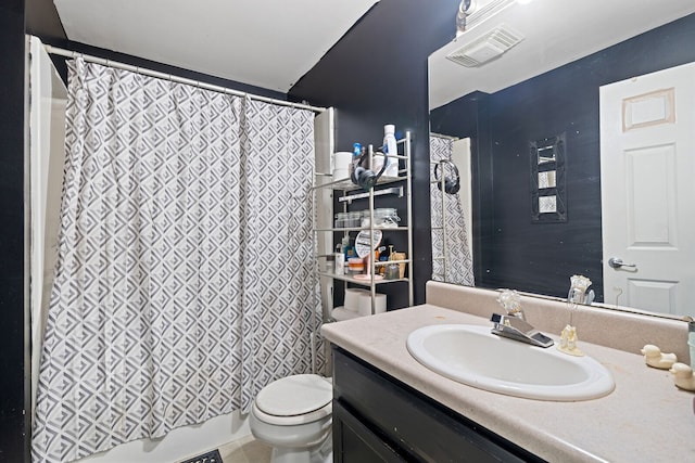 full bathroom featuring vanity, toilet, and shower / tub combo with curtain