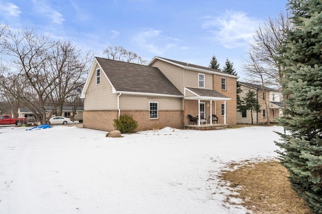 view of snow covered house