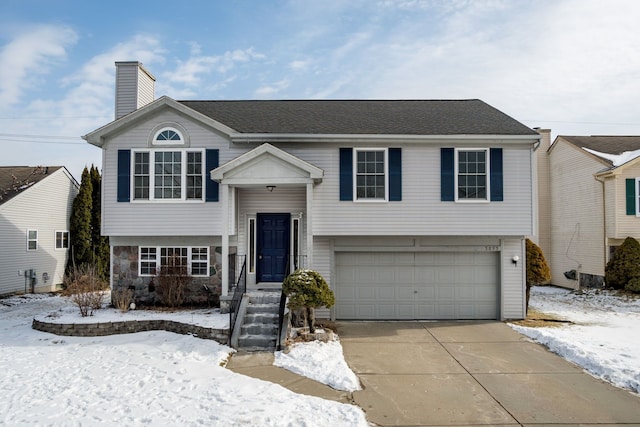 raised ranch featuring a garage