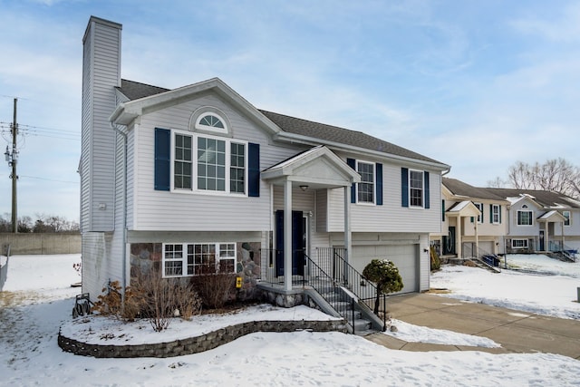 bi-level home featuring a garage