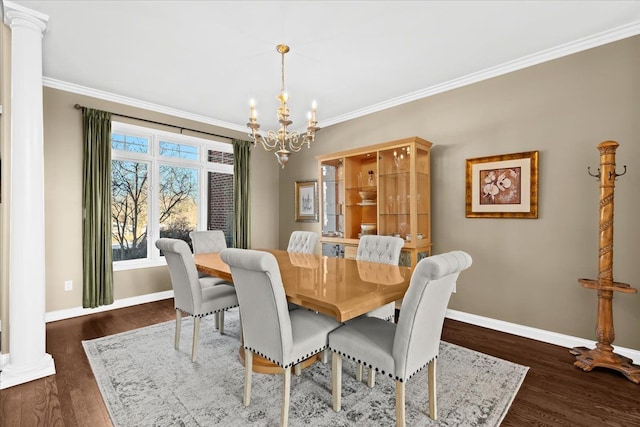 dining space featuring crown molding, dark hardwood / wood-style flooring, and ornate columns