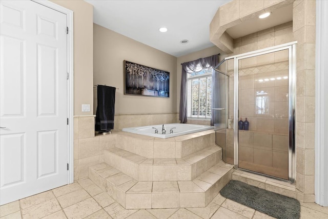 bathroom with separate shower and tub