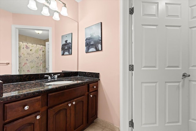 bathroom featuring vanity, curtained shower, and tile patterned floors