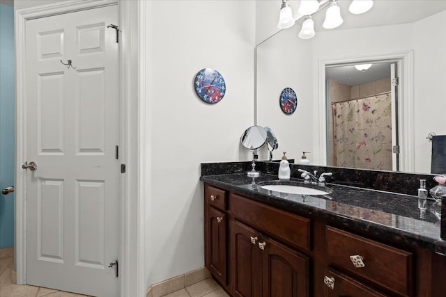 bathroom featuring a shower with curtain, vanity, and tile patterned flooring