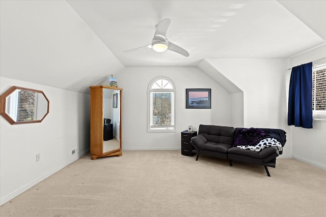 sitting room featuring lofted ceiling, light colored carpet, and ceiling fan