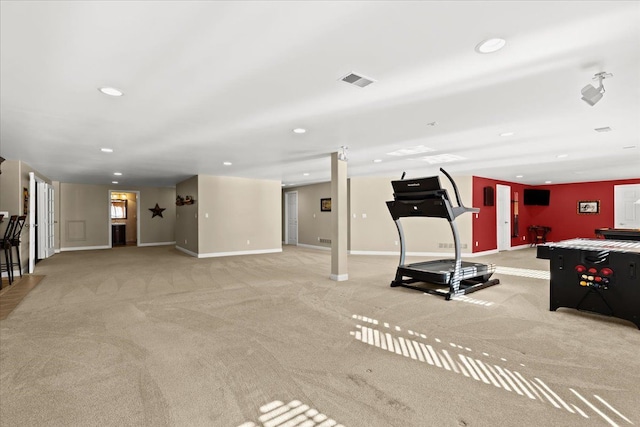 workout area featuring light carpet