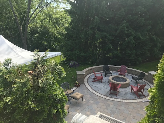 view of patio / terrace featuring an outdoor fire pit