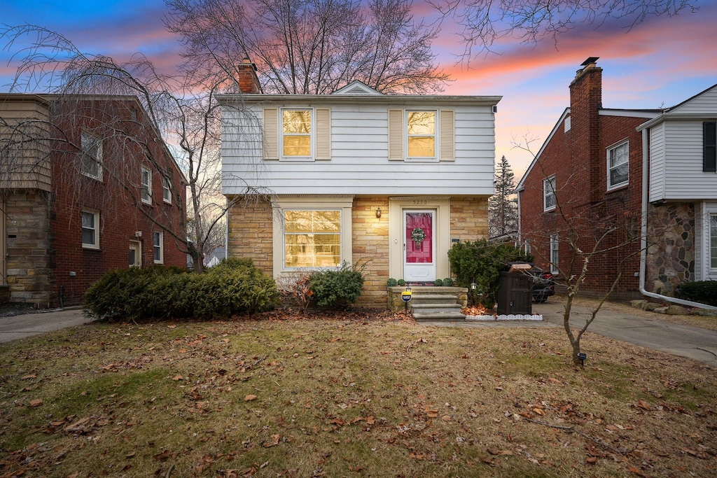 front of property with a lawn