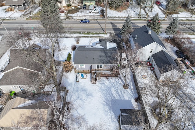 snowy aerial view with a residential view