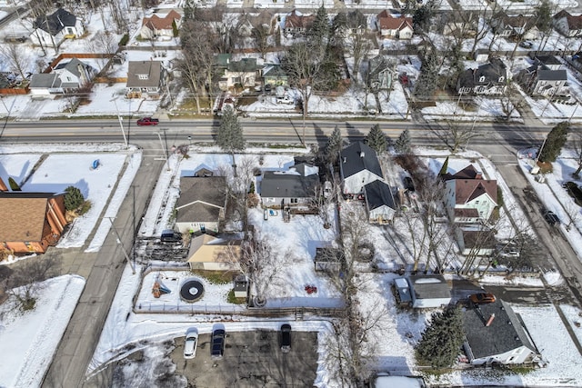 snowy aerial view featuring a residential view