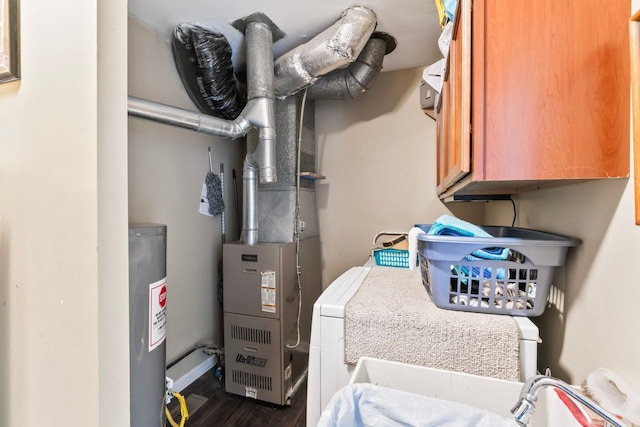 utilities featuring water heater and a sink