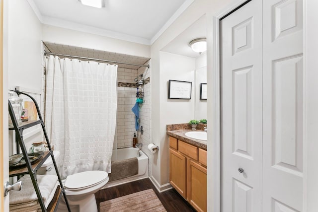 bathroom with vanity, wood finished floors, toilet, and crown molding