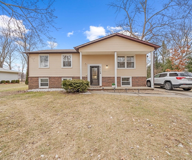 bi-level home with a front lawn