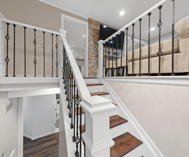 stairway with hardwood / wood-style floors