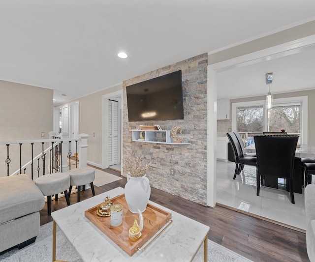 living room featuring crown molding and wood-type flooring