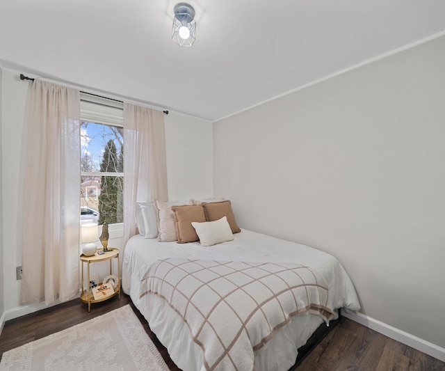 bedroom featuring dark hardwood / wood-style floors