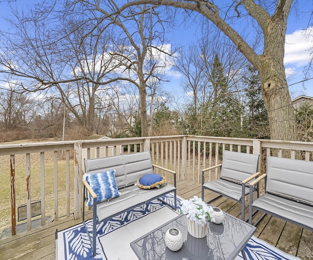 wooden terrace featuring outdoor lounge area