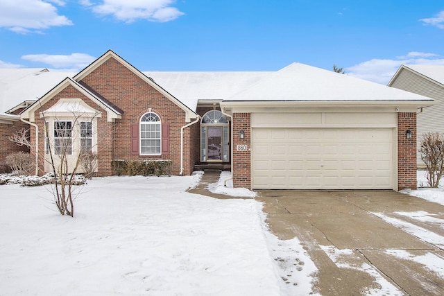 single story home featuring a garage