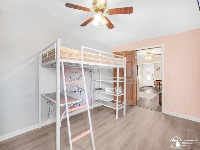 bedroom featuring hardwood / wood-style flooring and ceiling fan