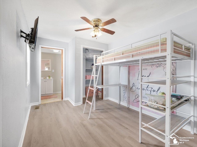 bedroom with wood-type flooring and ceiling fan