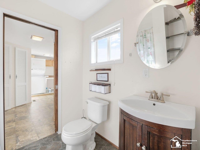 bathroom with vanity and toilet